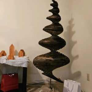 A spiral sculpture made of wood and metal.