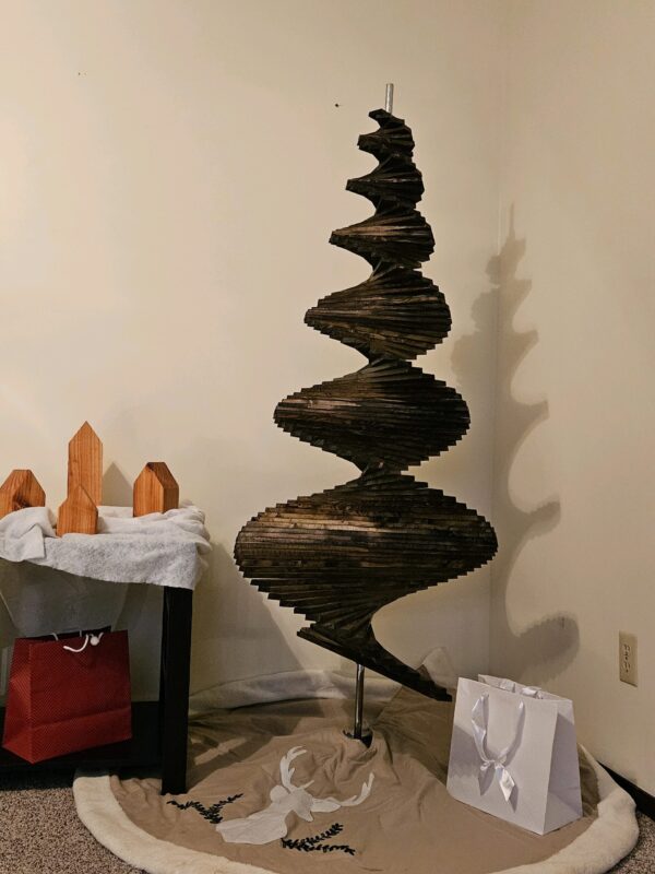 A spiral sculpture made of wood and metal.